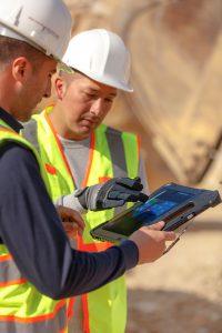 Warehouse workers with rugged tablets